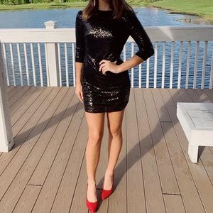 Black sequin mini dress with open back lace detail